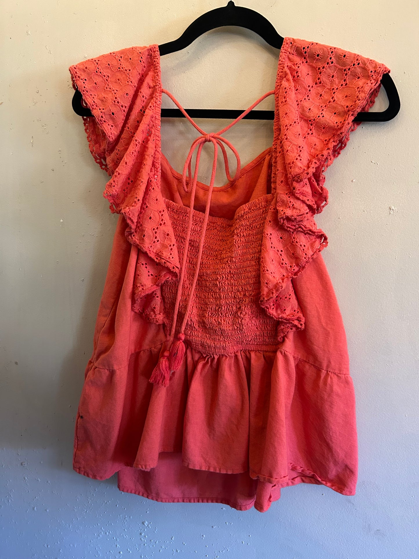 Sofia Vergara Coral ruffle top tie back